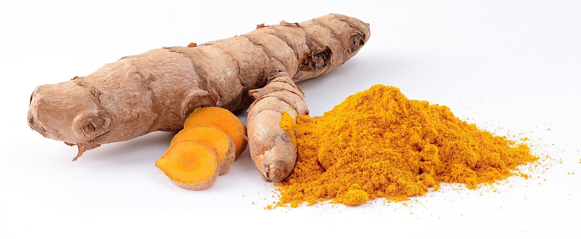 Whole harvested fresh turmeric rhizome roots